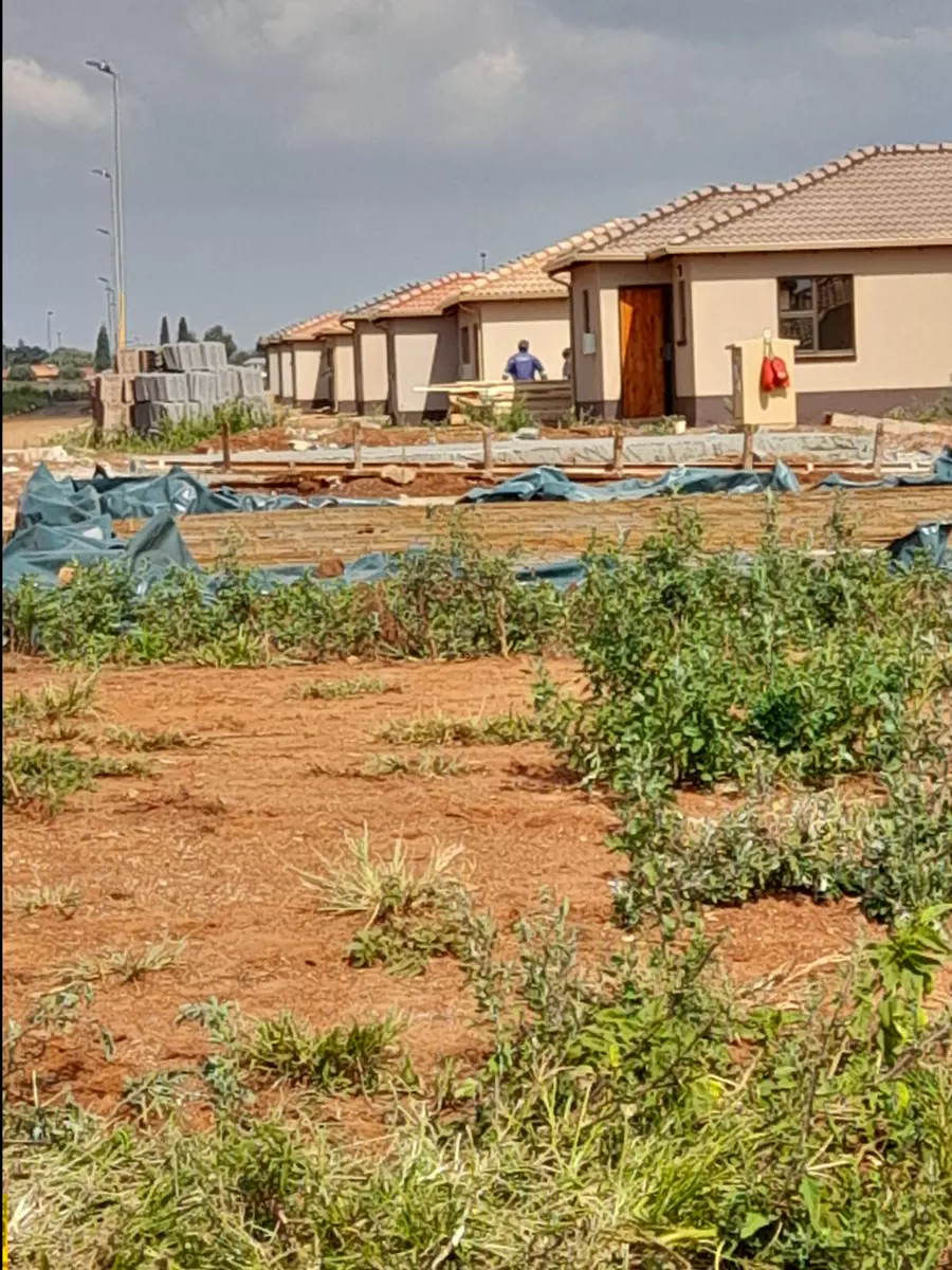Row of newly built houses under construction