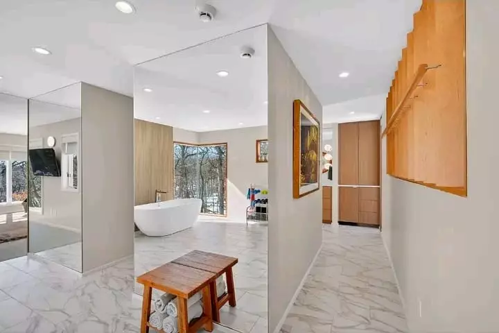 Modern hallway and luxury bathroom interior with large mirrors